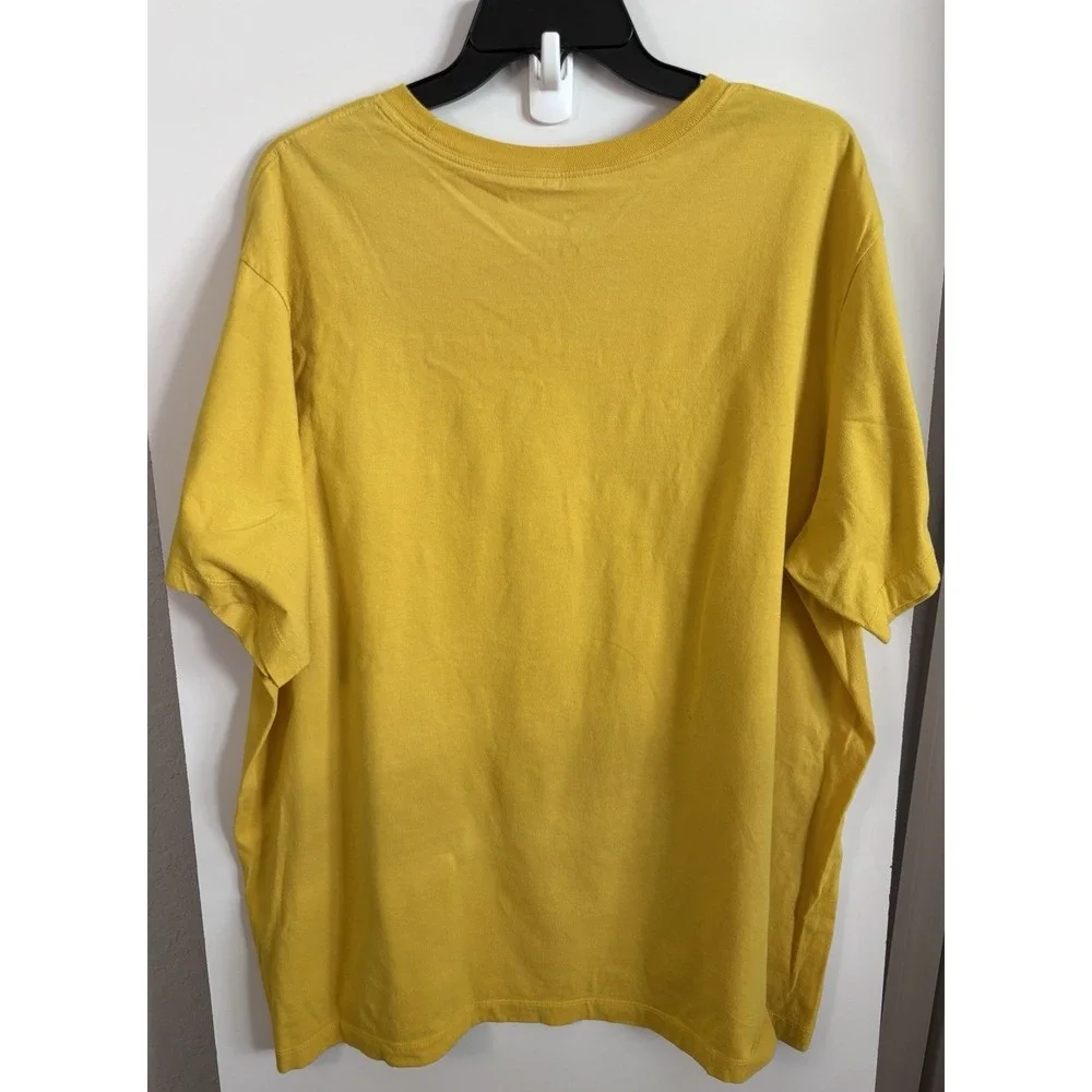 The Nike Cartoon Tee Mustard Yellow Size XXL graphic - Just Do It.